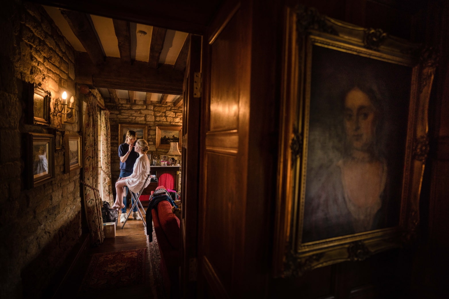 Intimate wedding portrait of bride during make-up